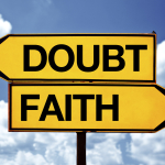 Doubt or faith, opposite signs. Two blank opposite signs against blue sky background.